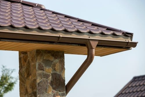 Gutter and downspout work on a home in the Wendell area